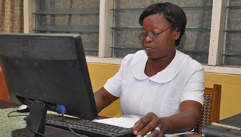 Image of a woman working on a computer. 