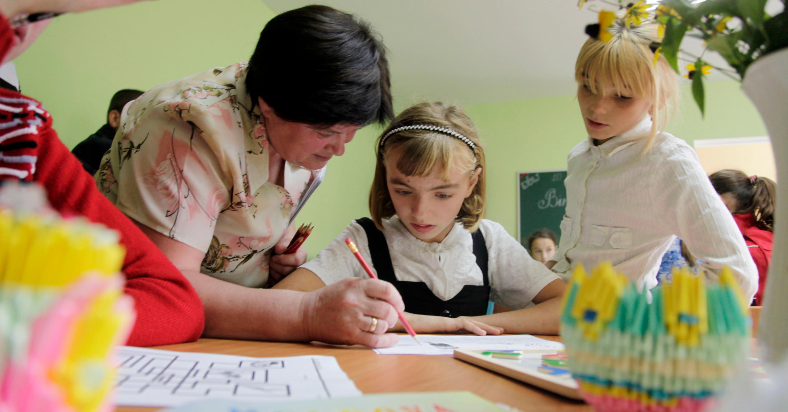 Students study at a school for children with special needs during the visit of United Nations Development Program administrator and former New Zealand Prime Minister Helen Clark speaks to residents of Dorotcaia, Moldova.