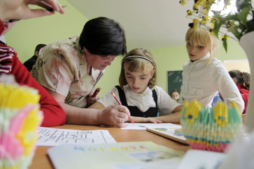 Students study at a school for children with special needs during the visit of United Nations Development Program administrator and former New Zealand Prime Minister Helen Clark speaks to residents of Dorotcaia, Moldova.