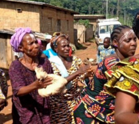 Photo of 5 women in colorful clothing in West Africa.