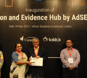 D4I’s Knowledge Management and Communications Specialist accepts the grant from the Global Affairs Canada-funded Advancing Sexual and Reproductive Health and Rights (AdSEARCH) project in Dhaka, Bangladesh