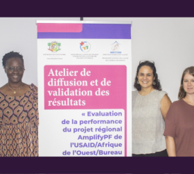 Photo showing two members of the team at a dissemination event in Cote d’Ivoire with Data for Impact (D4I) and CERA Group.