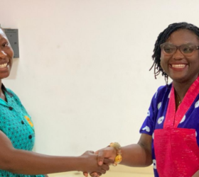 Gender competency workshop participant receives certificate.