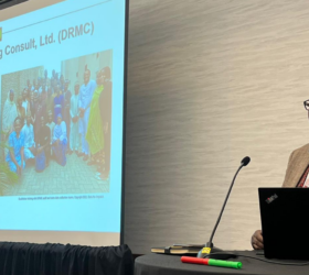 Samson Adebayo presenting at the AEA Conference 2023.